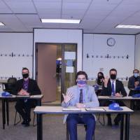 Students showing off their rings